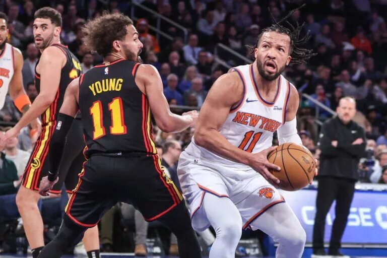 New York Knicks guard Jalen Brunson (11) looks to post up against Atlanta Hawks guard Trae Young (11) in the second quarter at Madison Square Garden.