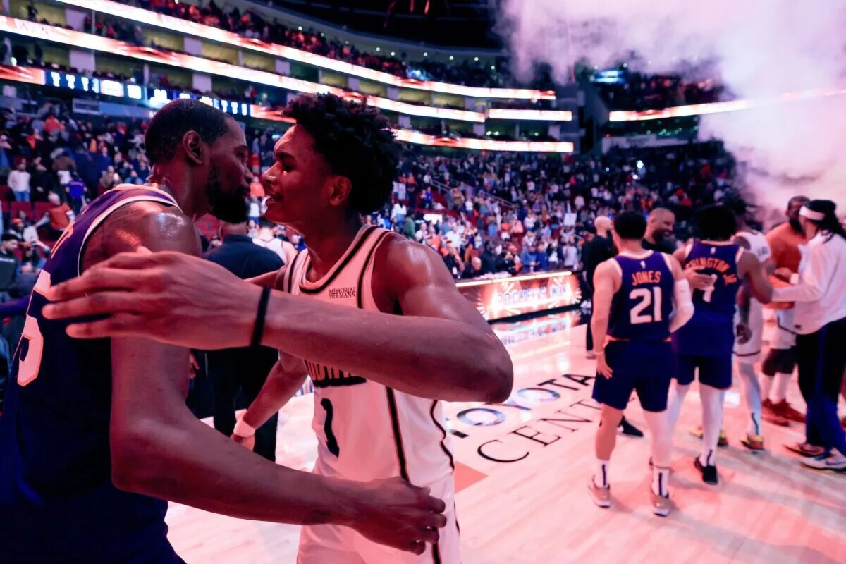 Houston Rockets guard-forward Amen Thompson and Phoenix Suns superstar Kevin Durant embrace