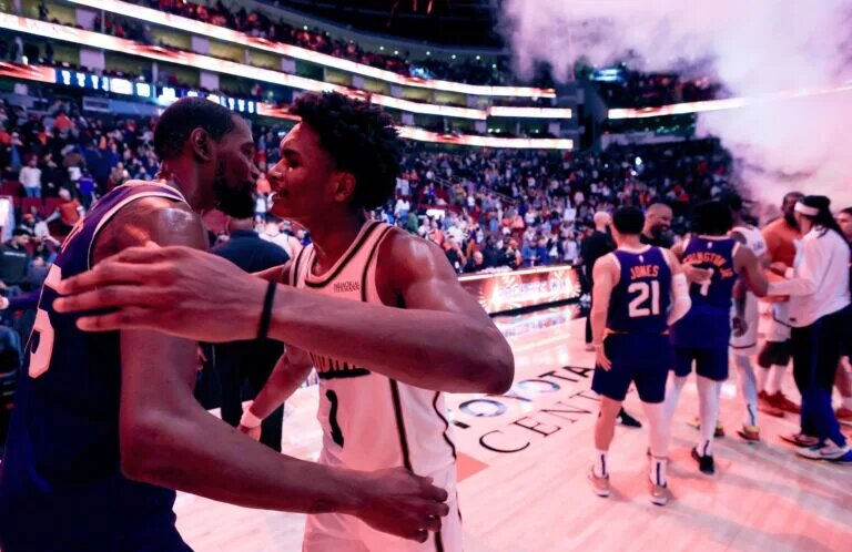 Houston Rockets guard-forward Amen Thompson and Phoenix Suns superstar Kevin Durant embrace