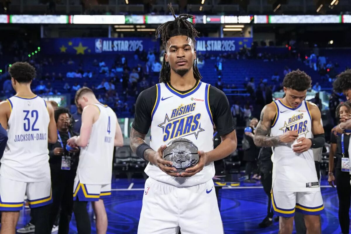 February 14, 2025; San Francisco, California, USA; Team C guard Stephon Castle (5) of the San Antonio Spurs holds the award during the 2025 NBA Rising Stars Game at Chase Center.