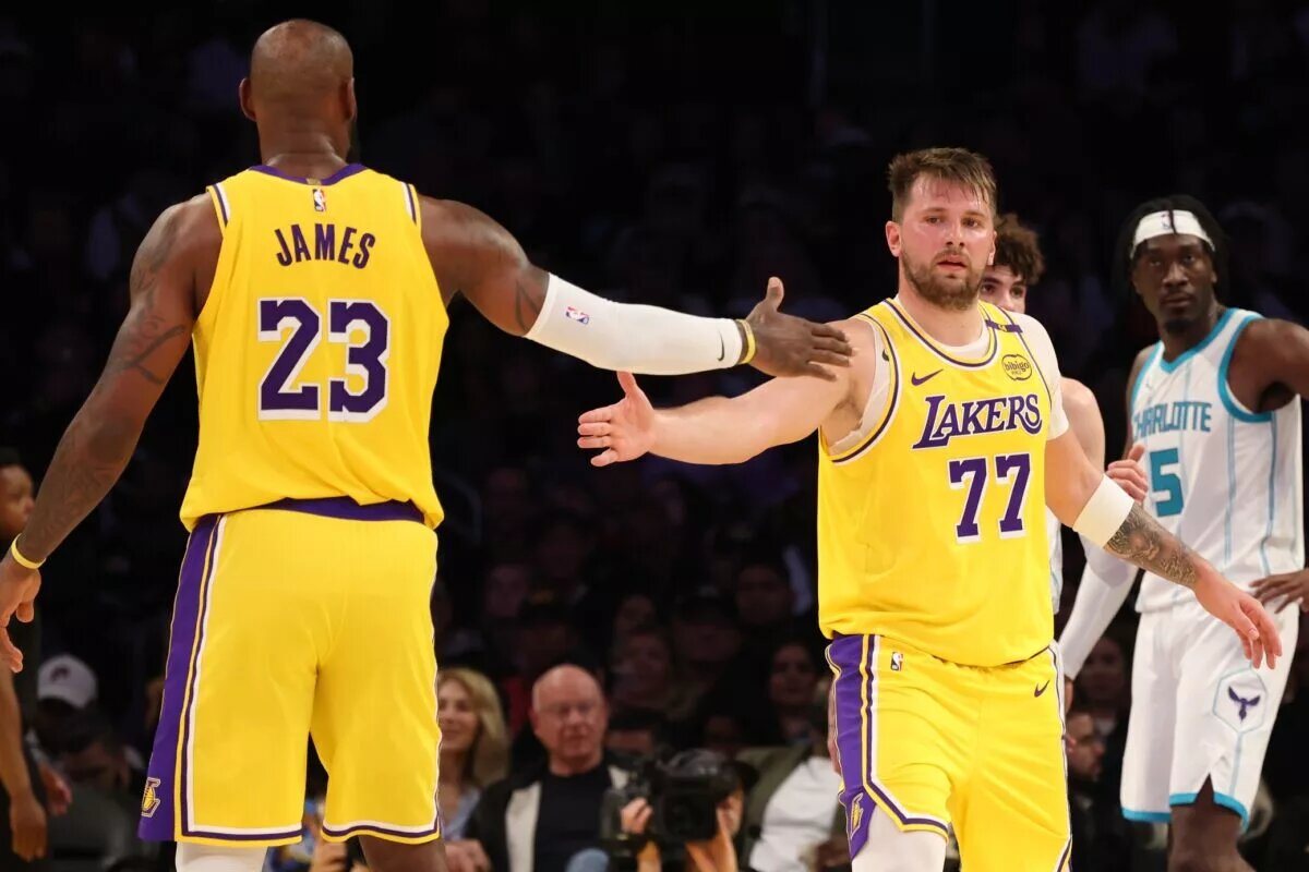 Los Angeles Lakers forward LeBron James (23) and guard Luka Doncic