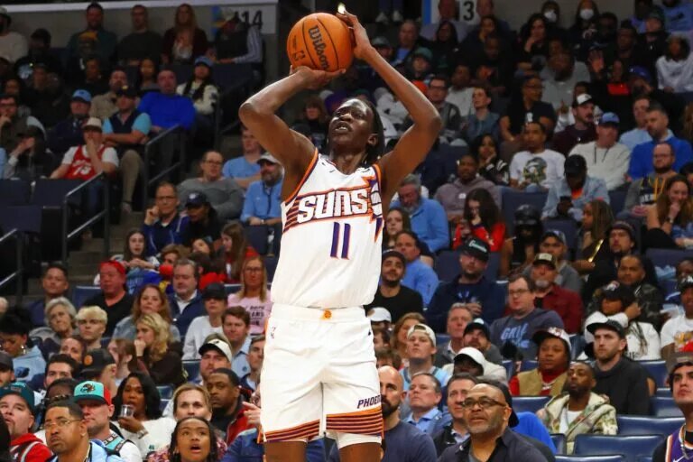 Feb 25, 2025; Memphis, Tennessee, USA; Phoenix Suns center Bol Bol (11) shoots for three during the third quarter against the Memphis Grizzlies at FedExForum. Mandatory Credit: Petre Thomas-Imagn Images