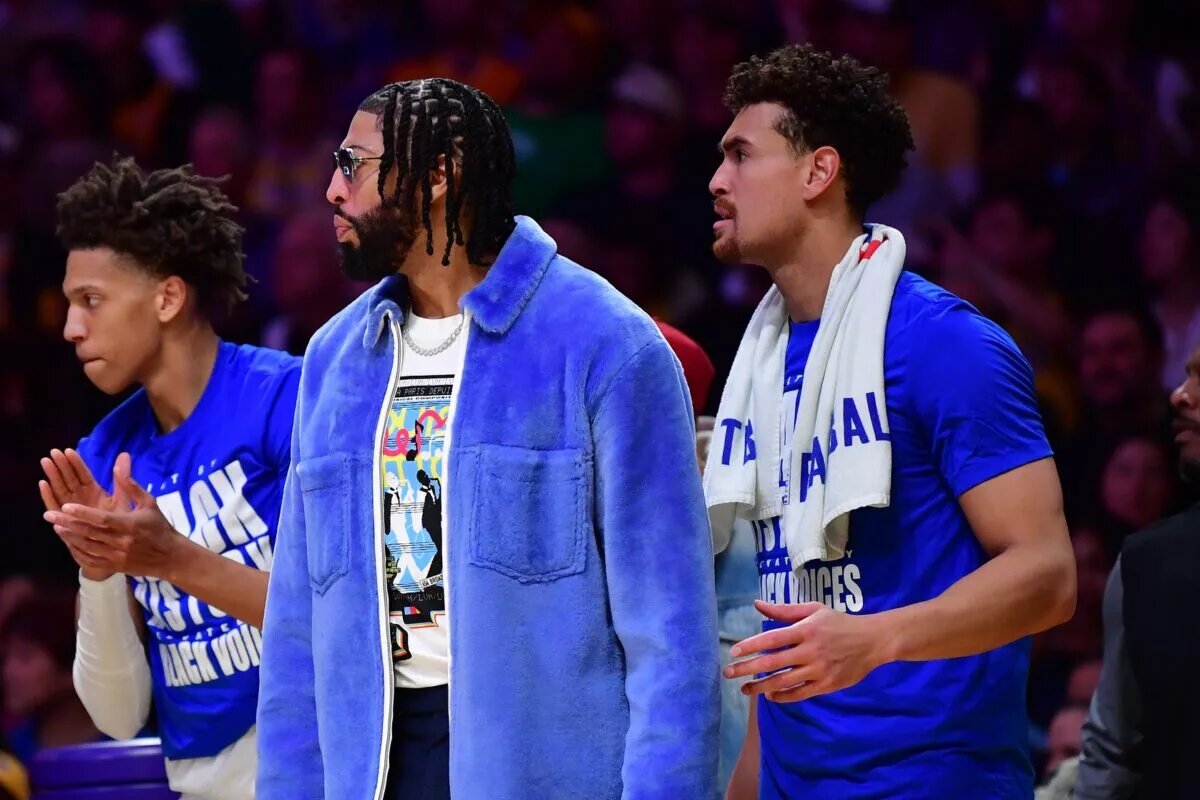 Feb 25, 2025; Los Angeles, California, USA; Dallas Mavericks forward Anthony Davis (3) watches the game from the bench during the second half at Crypto.com Arena. Mandatory Credit: Gary A. Vasquez-Imagn Images