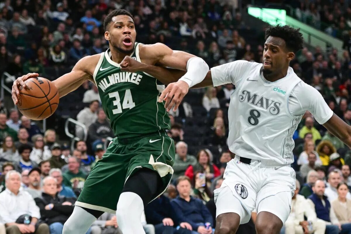 Milwaukee Bucks forward Giannis Antetokounmpo (34) drives for the basket against Dallas Mavericks forward Olivier-Maxence Prosper (8)