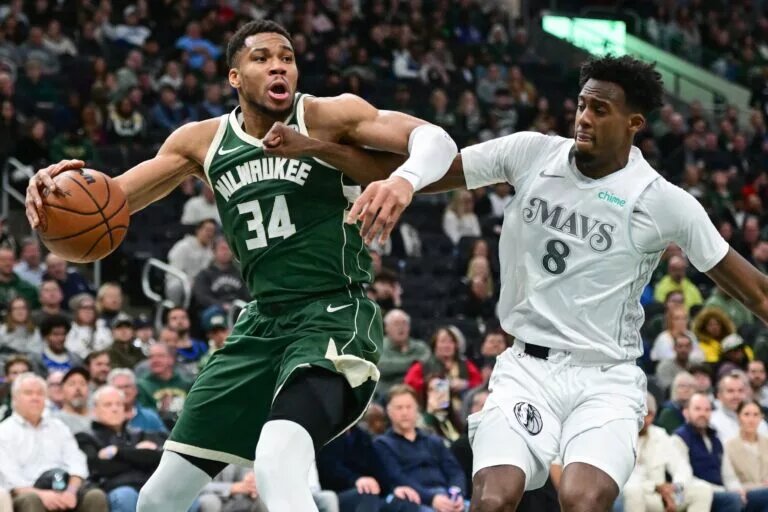 Milwaukee Bucks forward Giannis Antetokounmpo (34) drives for the basket against Dallas Mavericks forward Olivier-Maxence Prosper (8)