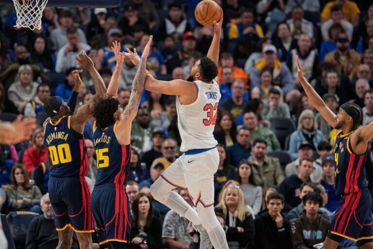 New York Knicks center Karl-Anthony Towns (32) drives