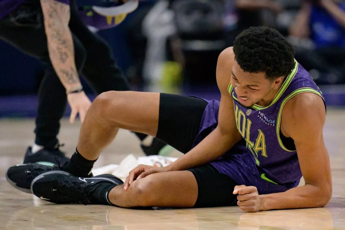 New Orleans Pelicans forward Trey Murphy III (25) reacts after falling