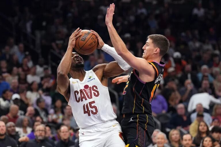 Phoenix Suns guard Collin Gillespie (12) guards Cleveland Cavaliers guard Donovan Mitchell (45)