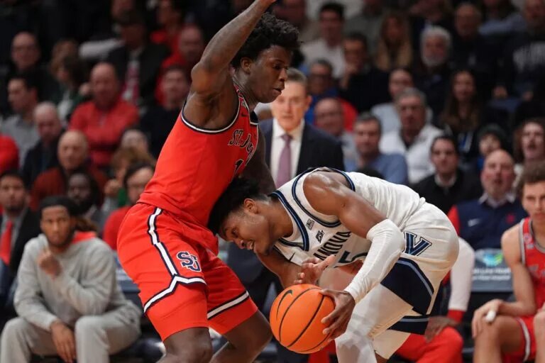 Villanova Wildcats guard Jordan Longino (15) drives against Saint John's Red Storm guard Kadary Richmond (1)