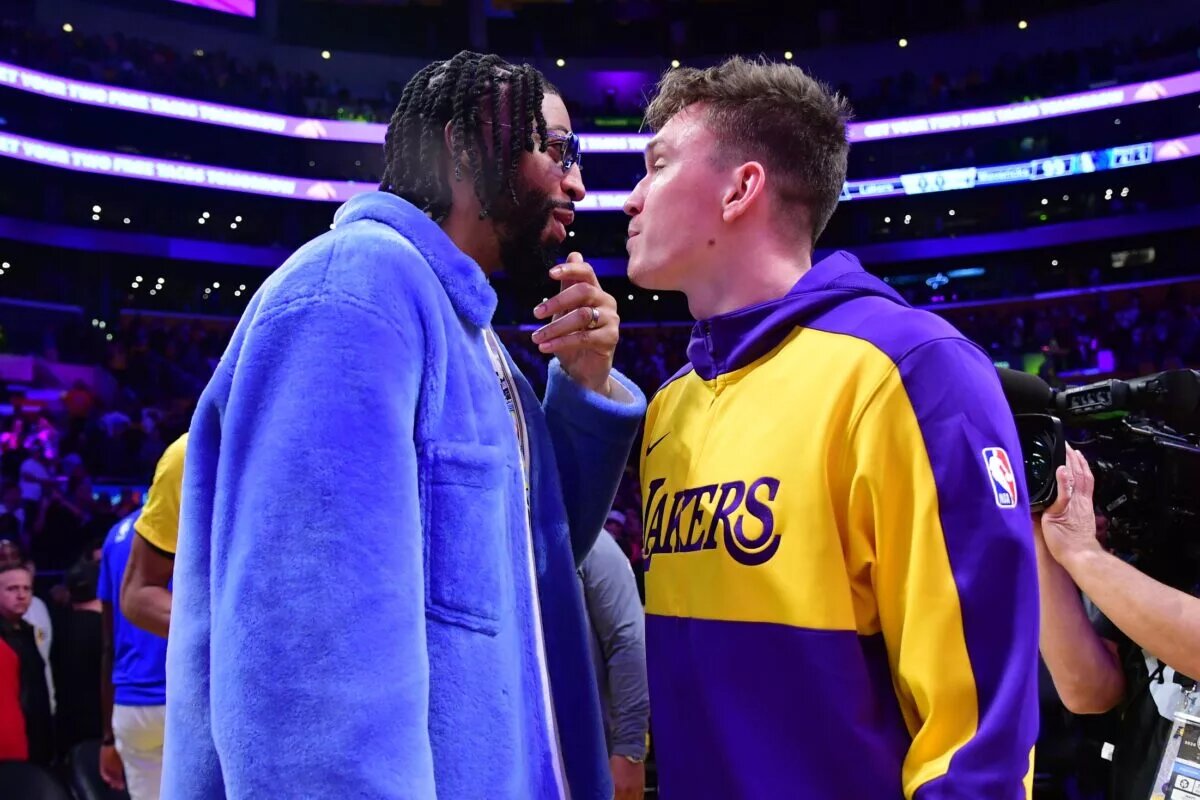 Dallas Mavericks forward Anthony Davis (left) reacts with Los Angeles Lakers guard Dalton Knecht (right)