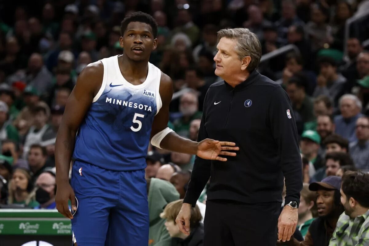 Minnesota Timberwolves head coach Chris Finch talks with guard Anthony Edwards