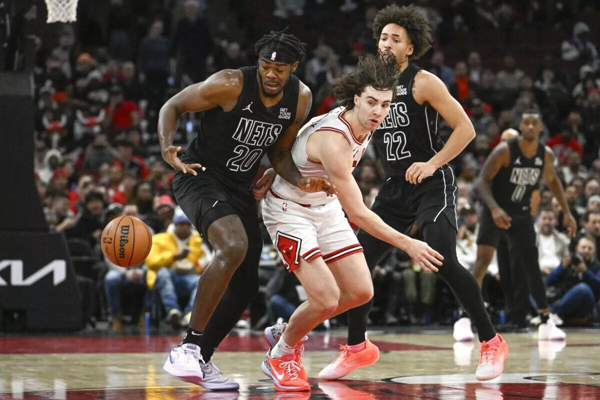 Dec 2, 2024; Chicago, Illinois, USA; Chicago Bulls guard Josh Giddey (3) loses the ball to Brooklyn Nets center Day'Ron Sharpe (20) and forward Jalen Wilson (22) during the second half at the United Center.
