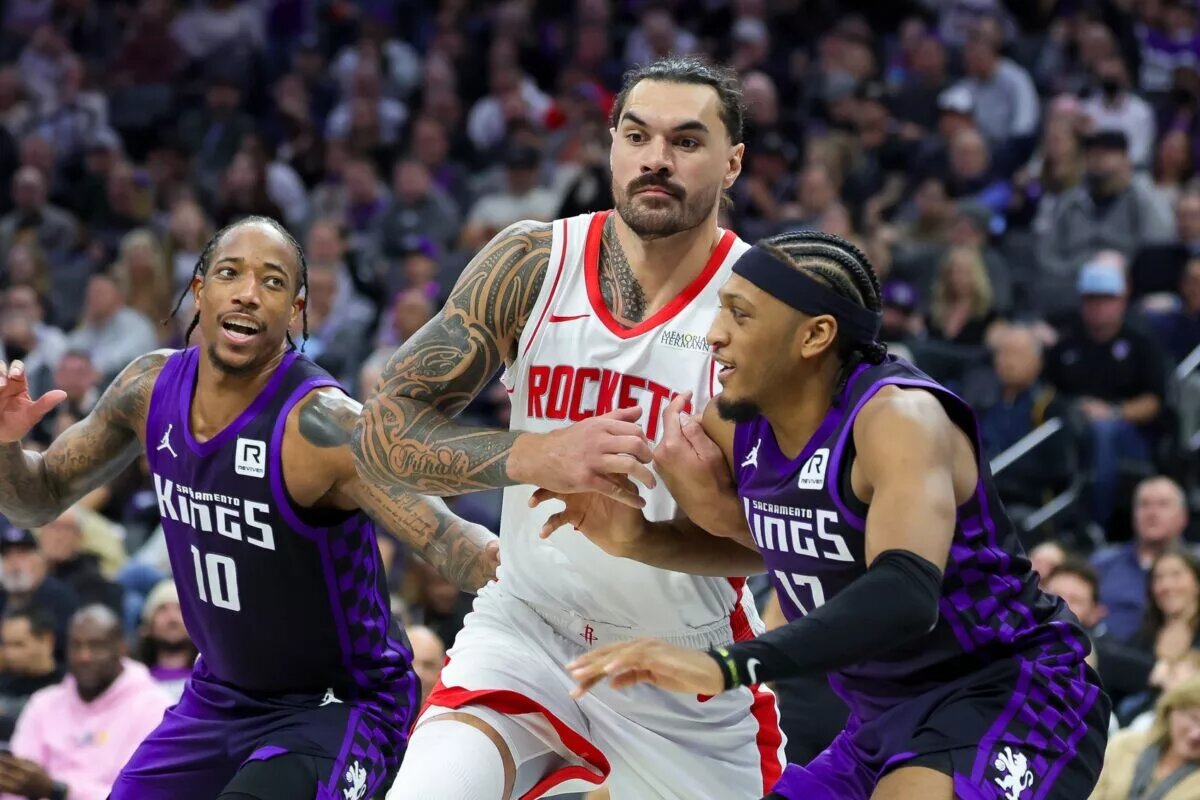 Sacramento Kings forward DeMar DeRozan and forward-center Isaac Jones attempt to box out Houston Rockets center Steven Adams