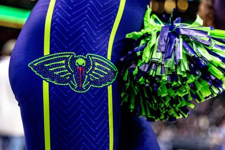 New Orleans Pelicans logo on cheerleader/dancer