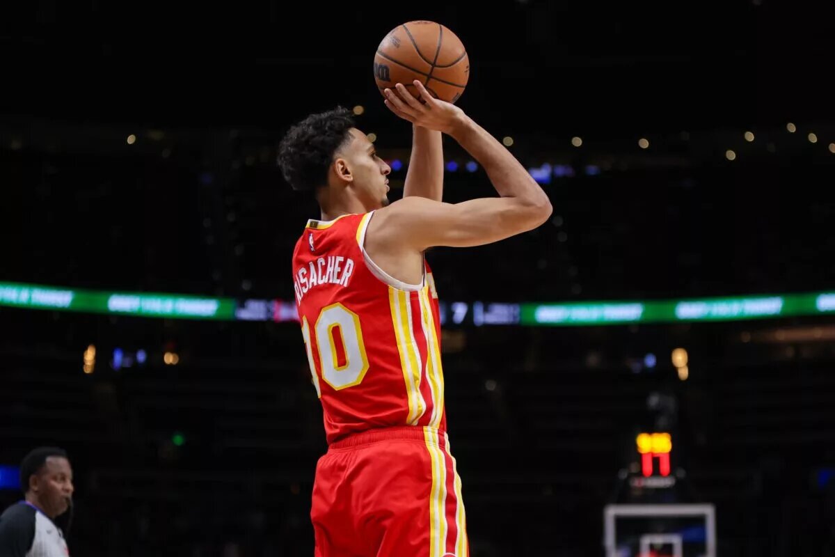 Atlanta Hawks forward Zaccharie Risacher (10) shoots against the San Antonio Spurs in the first quarter at State Farm Arena.