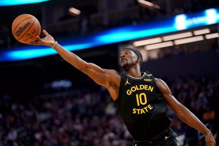 Feb 25, 2025; San Francisco, California, USA; Golden State Warriors forward Jimmy Butler III (10) attempts to grab a rebound against the Charlotte Hornets in the second quarter at the Chase Center. Mandatory Credit: Cary Edmondson-Imagn Images