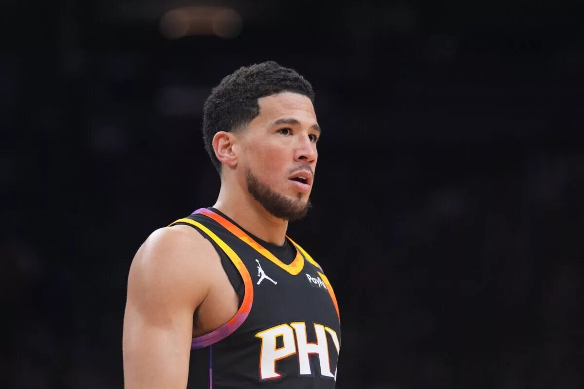 Feb 28, 2025; Phoenix, Arizona, USA; Phoenix Suns guard Devin Booker (1) looks on against the New Orleans Pelicans during the first half at Footprint Center. Mandatory Credit: Joe Camporeale-Imagn Images