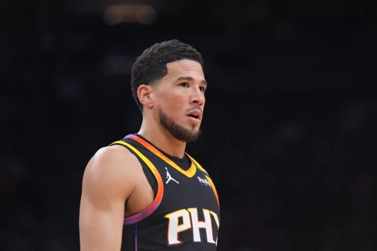 Feb 28, 2025; Phoenix, Arizona, USA; Phoenix Suns guard Devin Booker (1) looks on against the New Orleans Pelicans during the first half at Footprint Center. Mandatory Credit: Joe Camporeale-Imagn Images