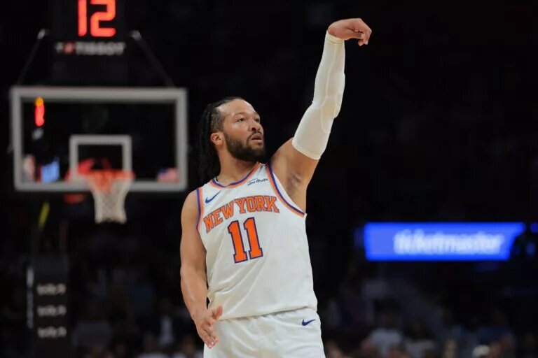 New York Knicks guard Jalen Brunson (11) watches his shot against the Miami Heat during the first quarter at Kaseya Center. Mandatory Credit: Sam