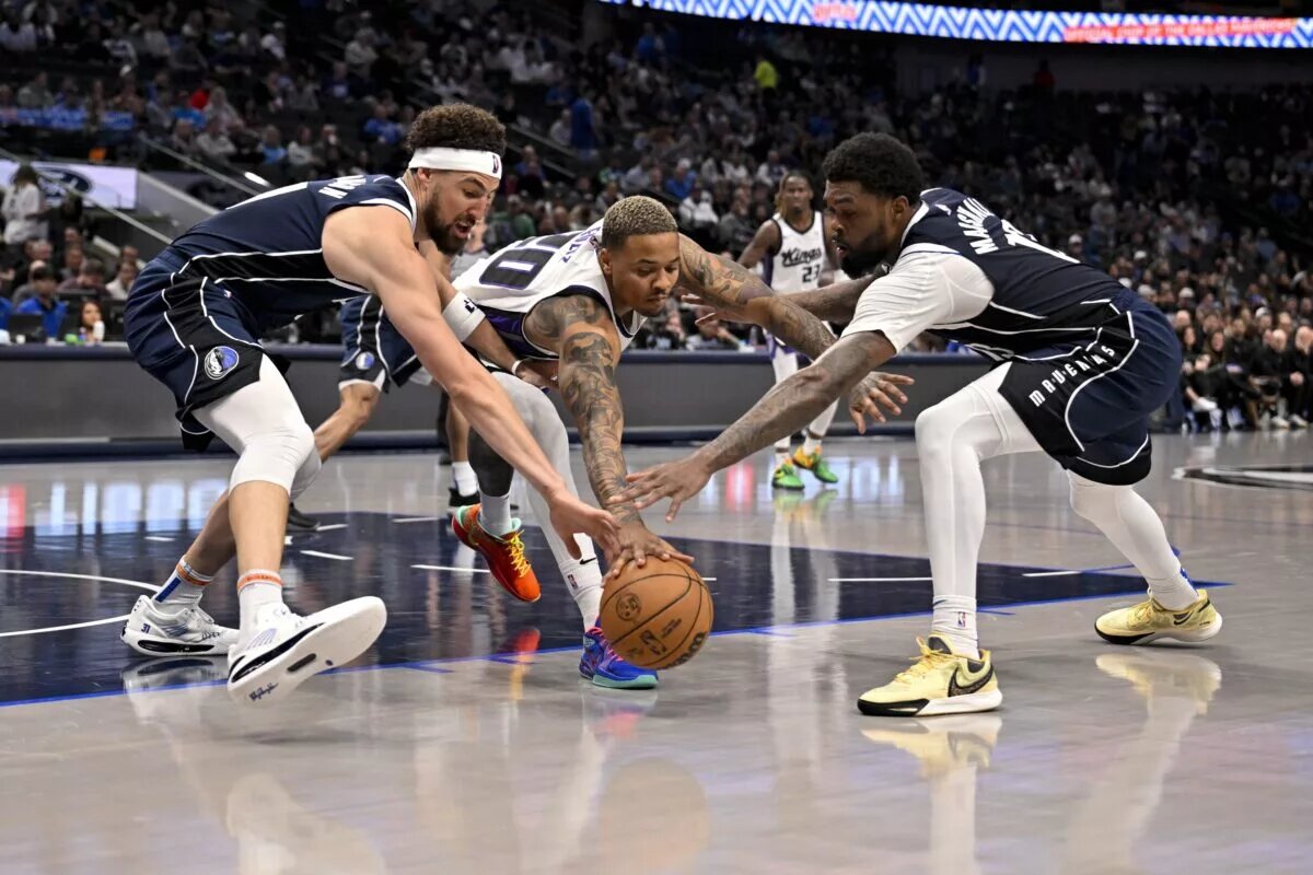 Mar 3, 2025; Dallas, Texas, USA; Dallas Mavericks guard Klay Thompson (31) and forward Naji Marshall (13) and Sacramento Kings guard Markelle Fultz (20) battle for the loose ball during the second half at the American Airlines Center.