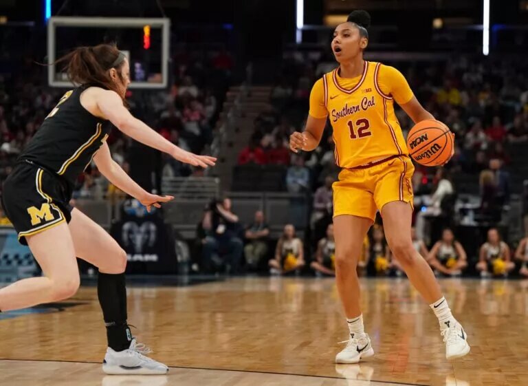 Mar 8, 2025; Indianapolis, IN, USA; Michigan Wolverines guard Syla Swords (12) defends against Southern California Trojans guard JuJu Watkins (12) during the second half of the Big Ten Conference Tournament semifinals at Gainbridge Fieldhouse. Mandatory Credit: Stephanie Amador Blondet-Imagn Images
