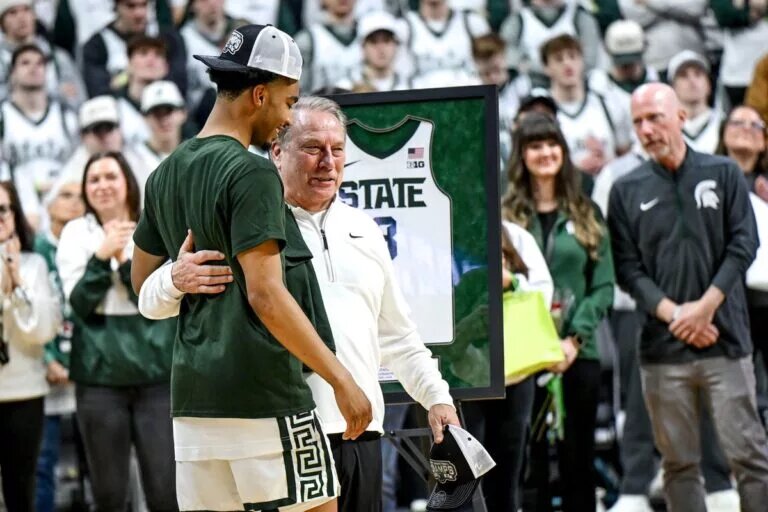Michigan State senior Jaden Akins, left, hugs head coach Tom Izzo after the game against Michigan on Sunday, March 9, 2025, at the Breslin Center in East Lansing.