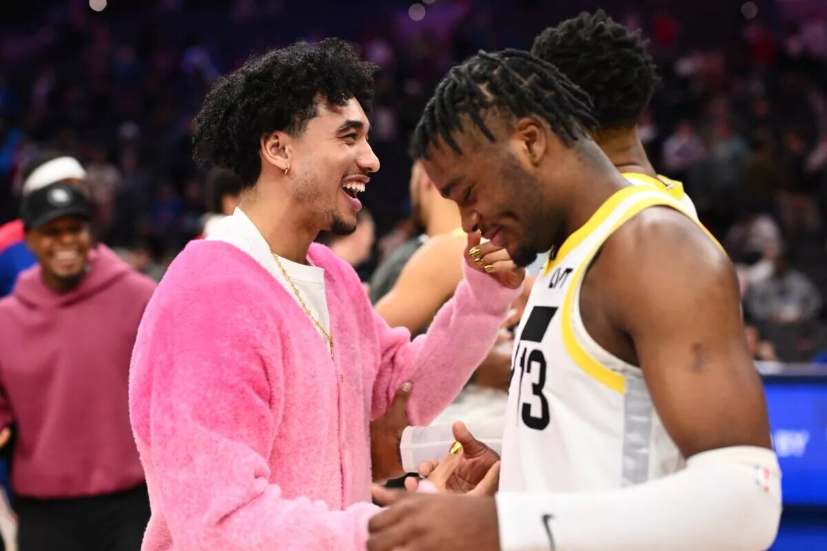 Utah Jazz rookie Isaiah Collier greets Philadelphia 76ers rookie Jared McCain