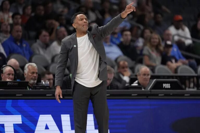 Mar 12, 2025; Charlotte, NC, USA; Virginia Cavaliers head coach Ron Sanchez signals to his team during the second half against the Virginia Cavaliers at Spectrum Center. Mandatory Credit: Jim Dedmon-Imagn Images