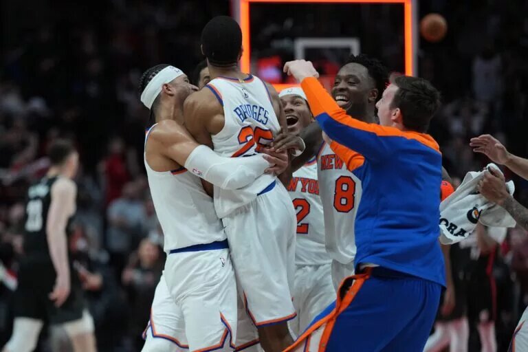 Mar 12, 2025; Portland, Oregon, USA; New York Knicks small forward Mikal Bridges (25) celebrates with teammates after making the game-winning shot in overtime against the Portland Trail Blazers at Moda Center. Mandatory Credit: Soobum Im-Imagn Images