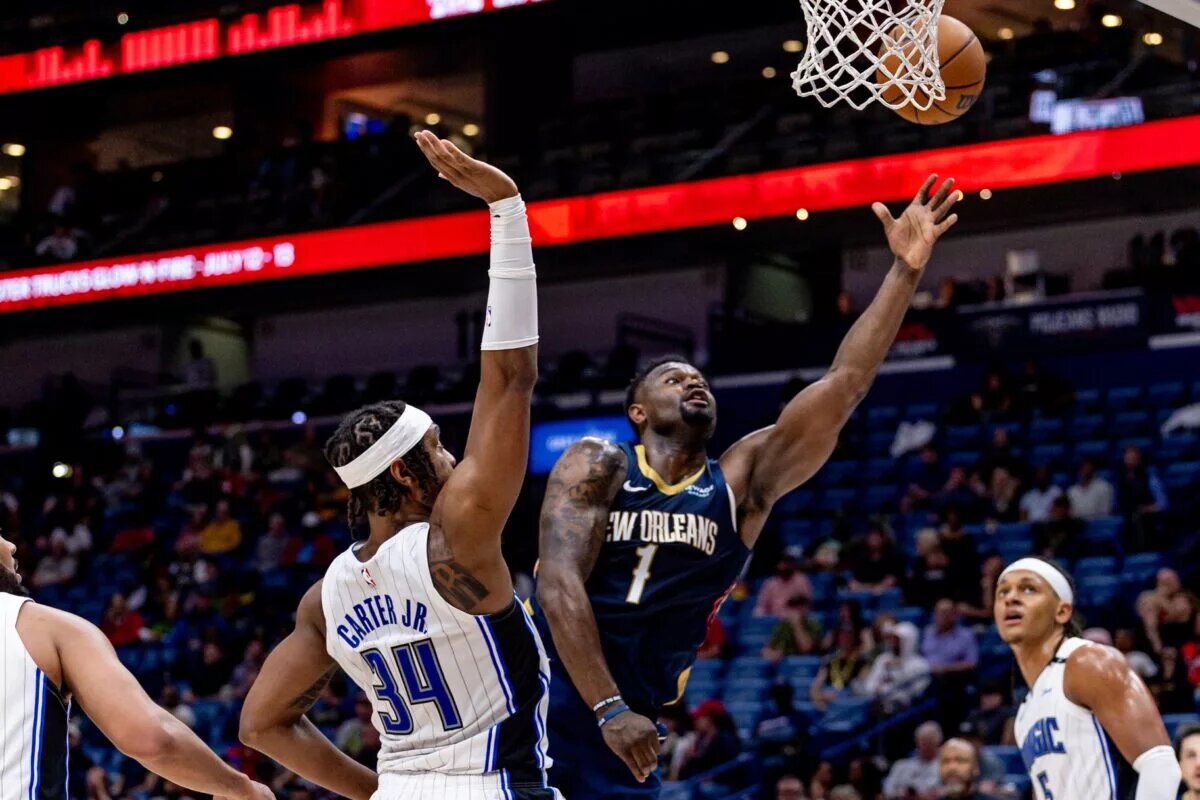 Mar 13, 2025; New Orleans, Louisiana, USA; New Orleans Pelicans forward Zion Williamson (1) drives to the basket against Orlando Magic center Wendell Carter Jr. (34) during the second half at Smoothie King Center. Mandatory Credit: Stephen Lew-Imagn Images