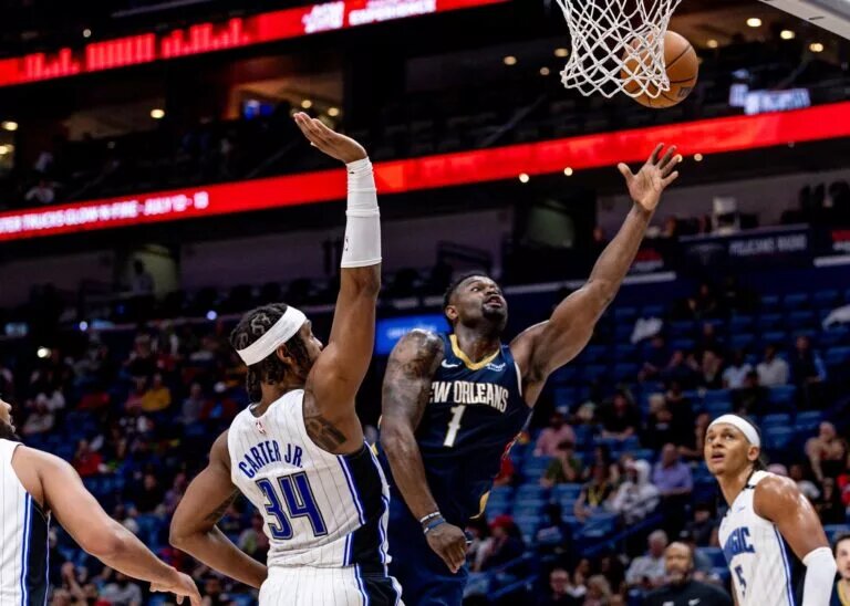 Mar 13, 2025; New Orleans, Louisiana, USA; New Orleans Pelicans forward Zion Williamson (1) drives to the basket against Orlando Magic center Wendell Carter Jr. (34) during the second half at Smoothie King Center. Mandatory Credit: Stephen Lew-Imagn Images