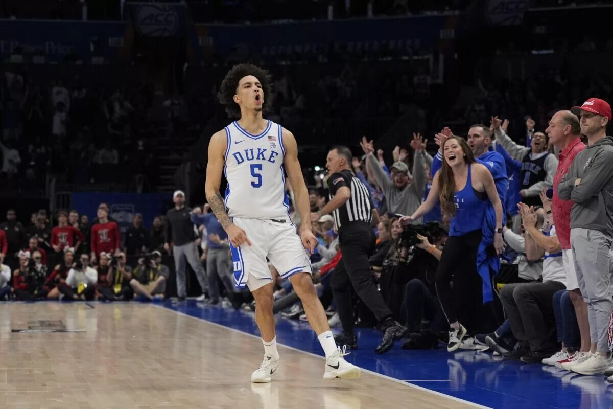 Mar 15, 2025; Charlotte, NC, USA; Duke Blue Devils guard Tyrese Proctor (5) reacts after a basket in the second half of the 2025 ACC Conference Championship game against the Louisville Cardinals at Spectrum Center. Mandatory Credit: Jim Dedmon-Imagn Images