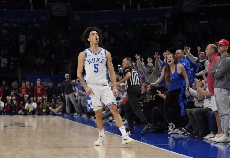Mar 15, 2025; Charlotte, NC, USA; Duke Blue Devils guard Tyrese Proctor (5) reacts after a basket in the second half of the 2025 ACC Conference Championship game against the Louisville Cardinals at Spectrum Center. Mandatory Credit: Jim Dedmon-Imagn Images