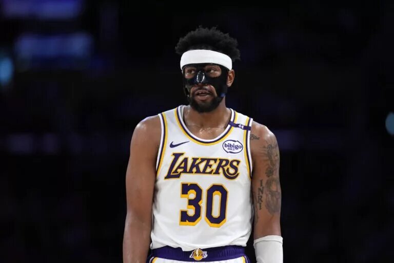 Mar 16, 2025; Los Angeles, California, USA; Los Angeles Lakers guard Jordan Goodwin (30) wears a protective face mask against the Phoenix Suns in the second half at Crypto.com Arena. Mandatory Credit: Kirby Lee-Imagn Images