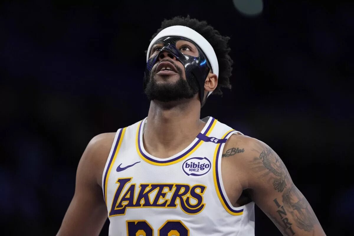 Mar 16, 2025; Los Angeles, California, USA; Los Angeles Lakers guard Jordan Goodwin (30) wears a protective face mask against the Phoenix Suns in the second half at Crypto.com Arena. Mandatory Credit: Kirby Lee-Imagn Images