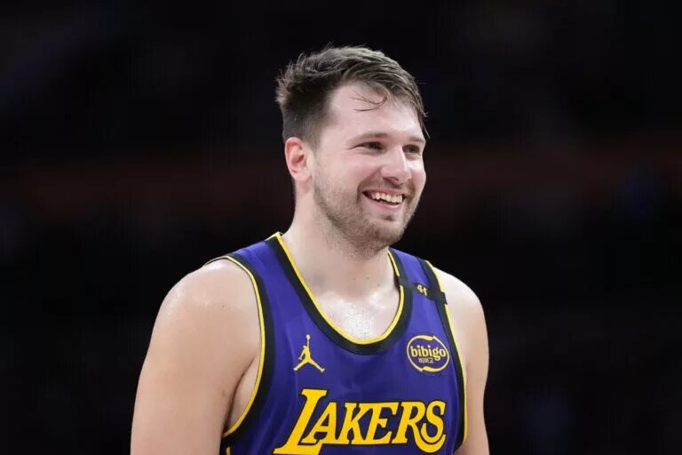 Mar 17, 2025; Los Angeles, California, USA; Los Angeles Lakers guard Luka Doncic (77) reacts against the San Antonio Spurs in the first half at Crypto.com Arena. Mandatory Credit: Kirby Lee-Imagn Images