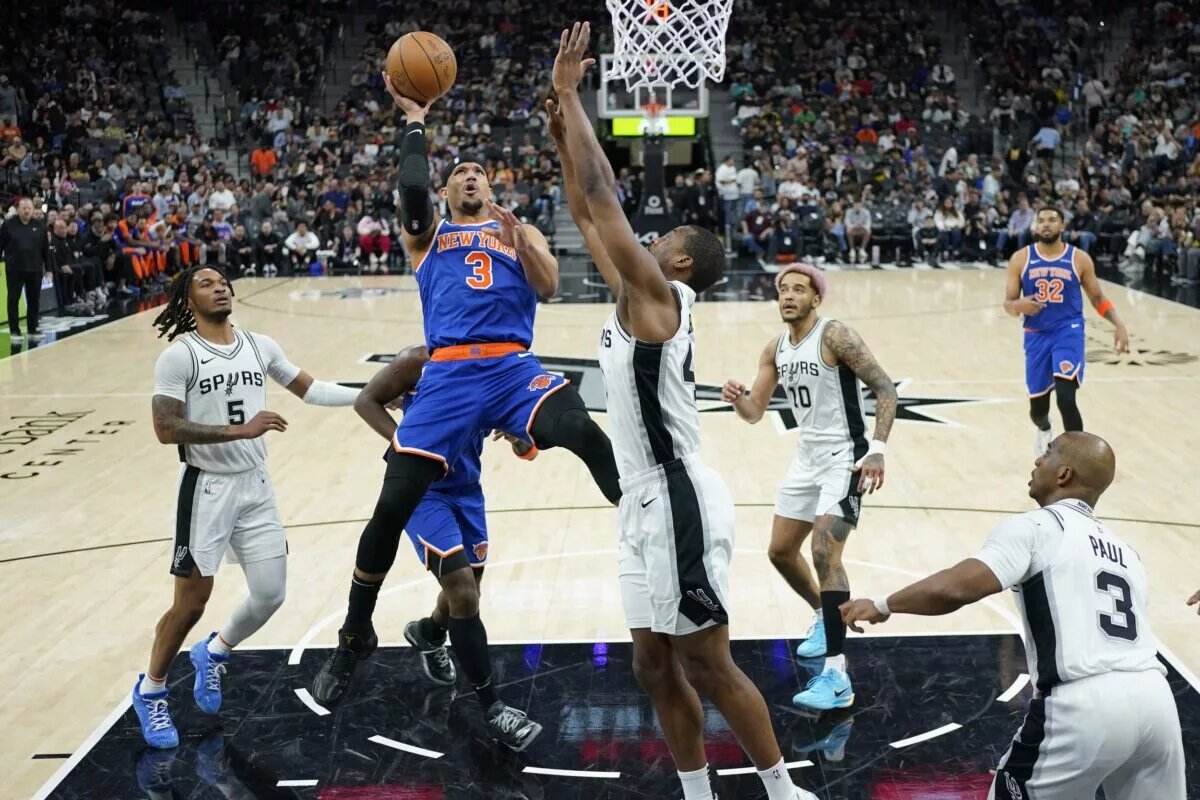 Mar 19, 2025; San Antonio, Texas, USA; New York Knicks forward Josh Hart (3) shoots over San Antonio Spurs center Bismack Biyombo (18) during the second half at Frost Bank Center. Mandatory Credit: Scott Wachter-Imagn Images