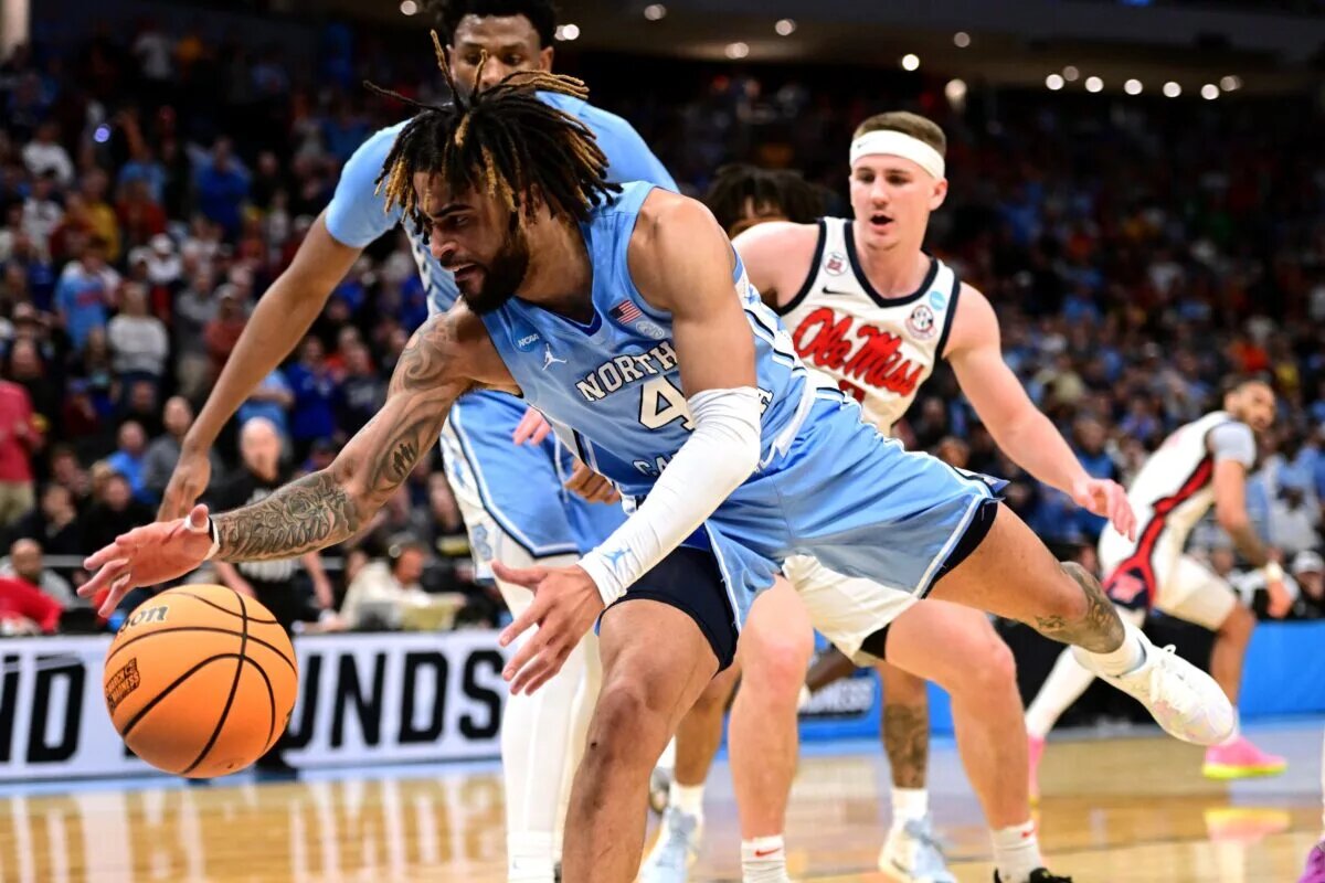 Mar 21, 2025; Milwaukee, WI, USA; North Carolina Tar Heels guard RJ Davis (4) chases a loose ball during the second half of a first round NCAA men’s tournament game against the Mississippi Rebels at Fiserv Forum. Mandatory Credit: Benny Sieu-Imagn Images