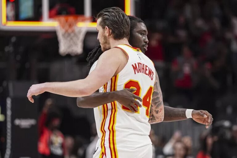 Atlanta Hawks guards Keaton Wallace and Garrison Mathews embrace