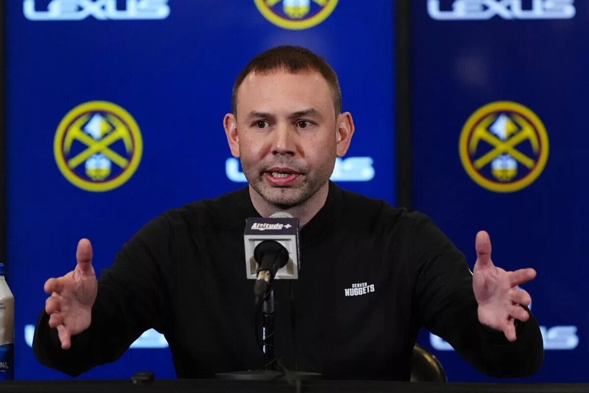 Denver Nuggets interim head coach David Adelman speaks to the media