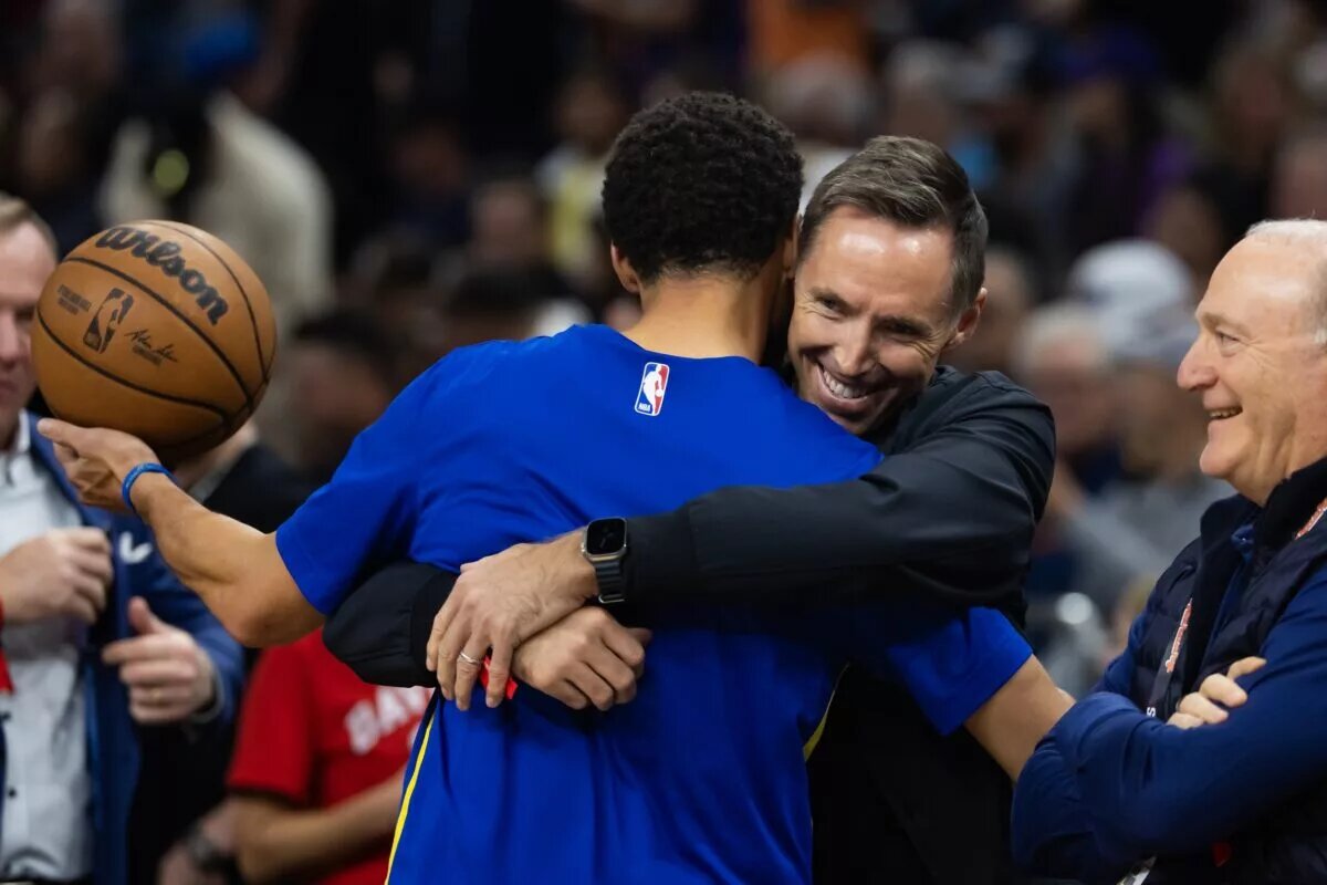 Golden State Warriors guard Stephen Curry (left) greets Steve Nash