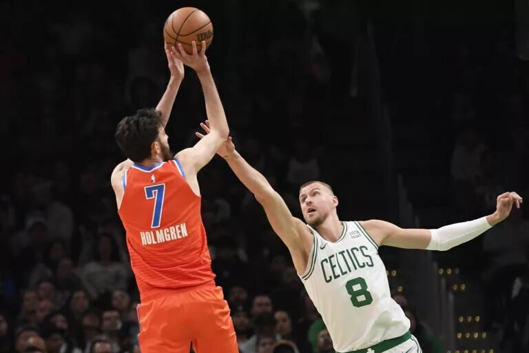 Oklahoma City Thunder forward Chet Holmgren (7) and Boston Celtics center Kristaps Porzingis