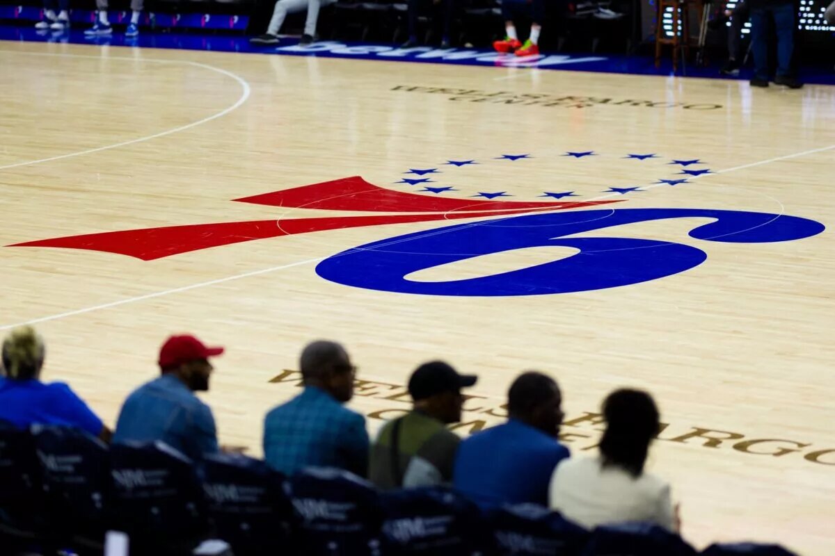 Philadelphia 76ers logo on home court