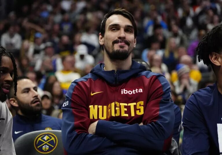 Feb 3, 2025; Denver, Colorado, USA; Denver Nuggets forward Dario Saric (9) on the bench in the second half against the New Orleans Pelicans at Ball Arena. Mandatory Credit: Ron Chenoy-Imagn Images