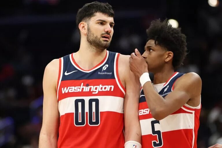 Washington Wizards guard AJ Johnson directs Tristan Vukcevic