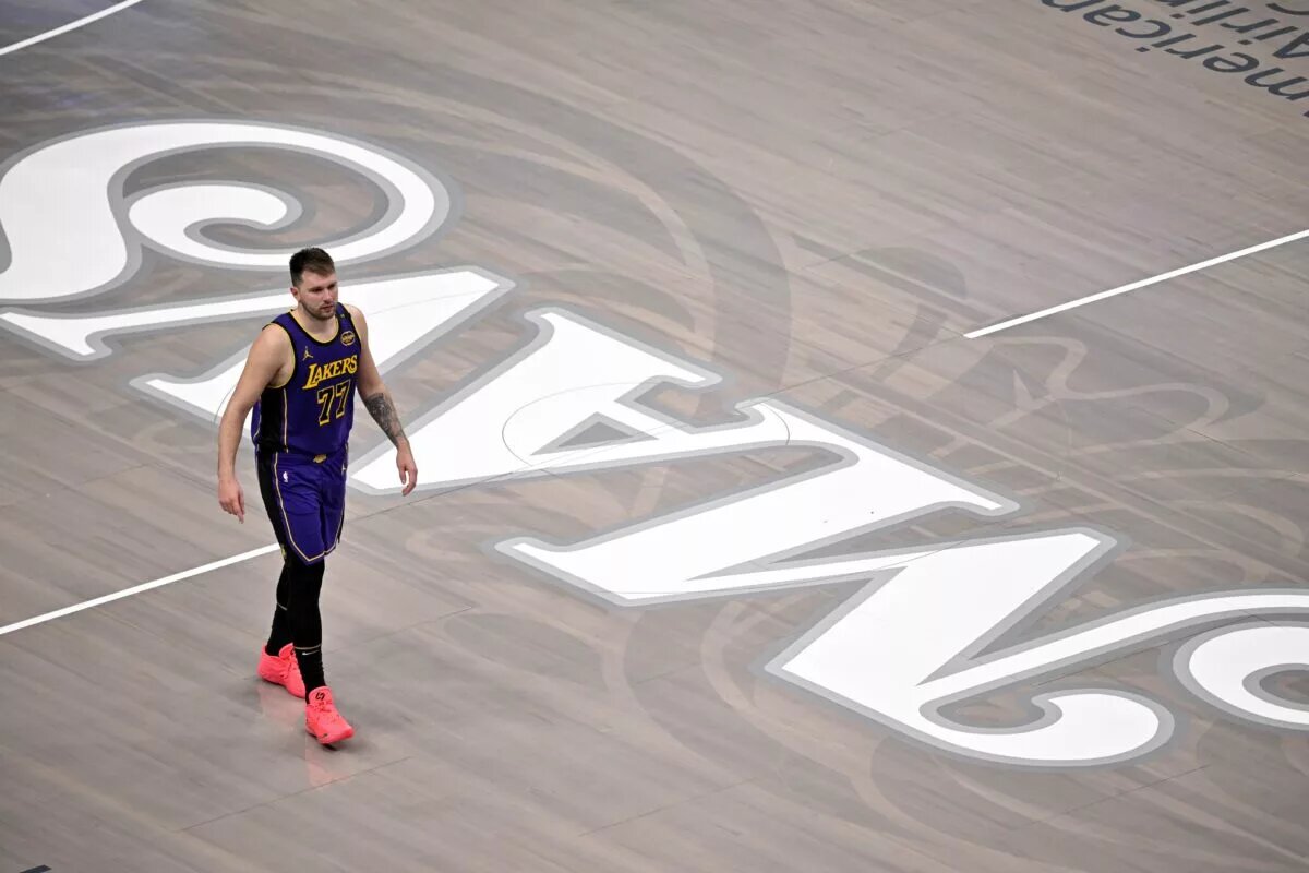 Apr 9, 2025; Dallas, Texas, USA; Los Angeles Lakers guard Luka Doncic (77) walks back on to the court during the fourth quarter against the Dallas Mavericks at the American Airlines Center. Mandatory Credit: Jerome Miron-Imagn Images