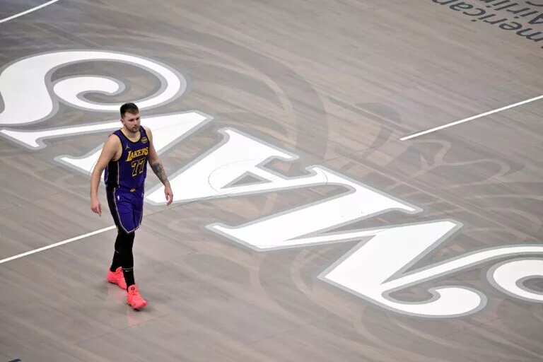 Apr 9, 2025; Dallas, Texas, USA; Los Angeles Lakers guard Luka Doncic (77) walks back on to the court during the fourth quarter against the Dallas Mavericks at the American Airlines Center. Mandatory Credit: Jerome Miron-Imagn Images