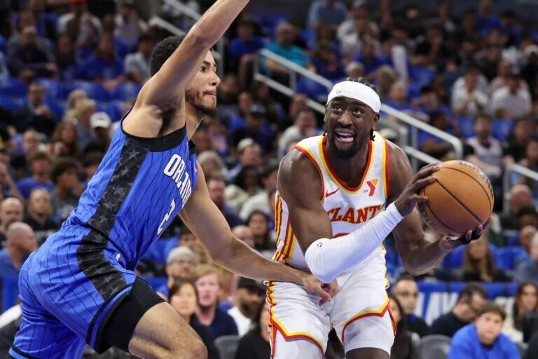 Apr 15, 2025; Orlando, Florida, USA; Orlando Magic guard Caleb Houstan (2) guards Atlanta Hawks guard Caris LeVert (3) in the first quarter at Kia Center. Mandatory Credit: Nathan Ray Seebeck-Imagn Images