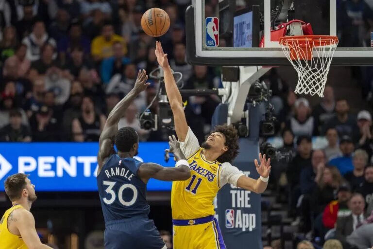 Apr 25, 2025; Minneapolis, Minnesota, USA; Minnesota Timberwolves forward Julius Randle (30) shoots the ball over Los Angeles Lakers center Jaxson Hayes (11) in the first half during game three of first round for the 2024 NBA Playoffs at Target Center. Mandatory Credit: Jesse Johnson-Imagn Images