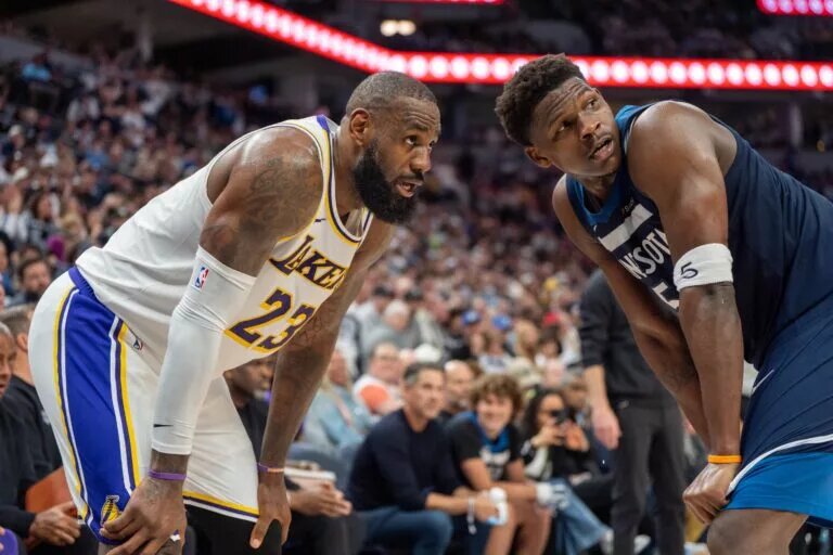 Minnesota Timberwolves guard Anthony Edwards (5) guards Los Angeles Lakers forward LeBron James